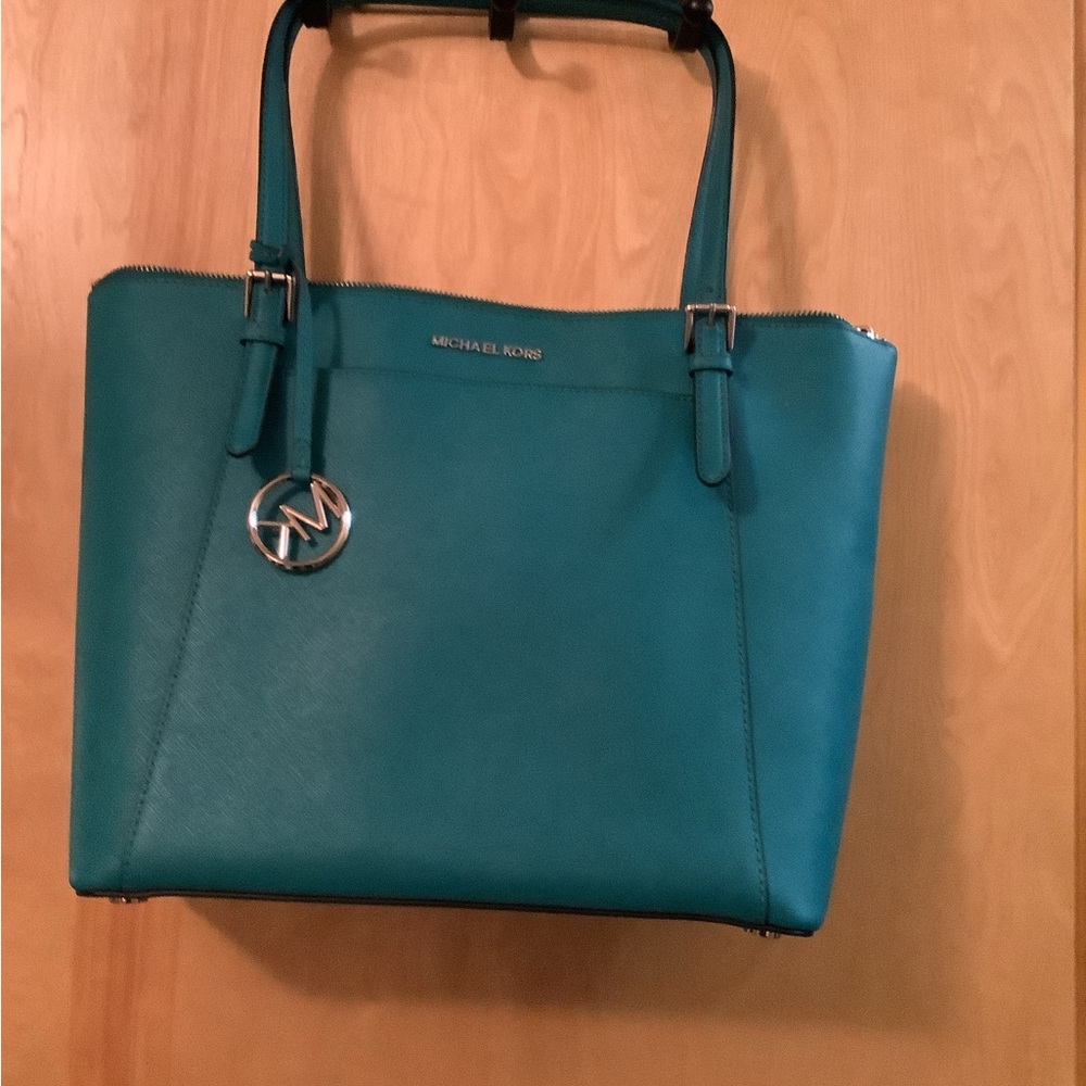 Excellent condition Michael Kors Tote with matching wallet.